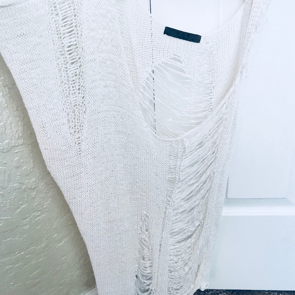 One sleeved (one tank sleeve) destroyed knit top
